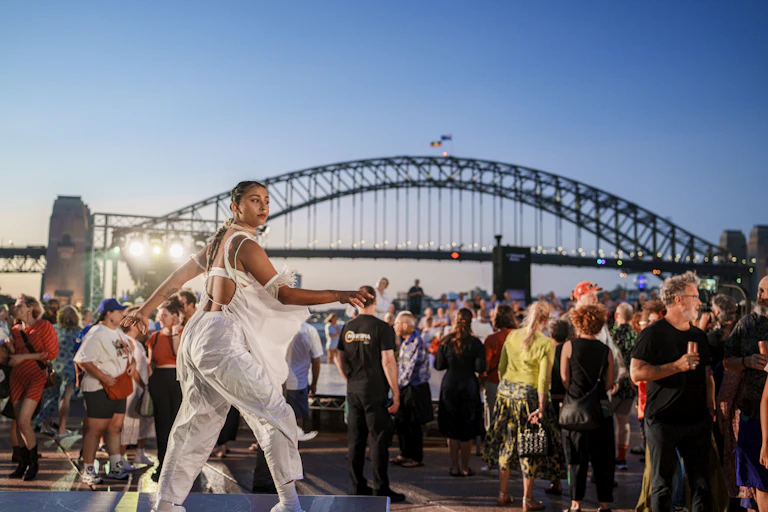 A dancer in front of Sydney Harbour Bridge.