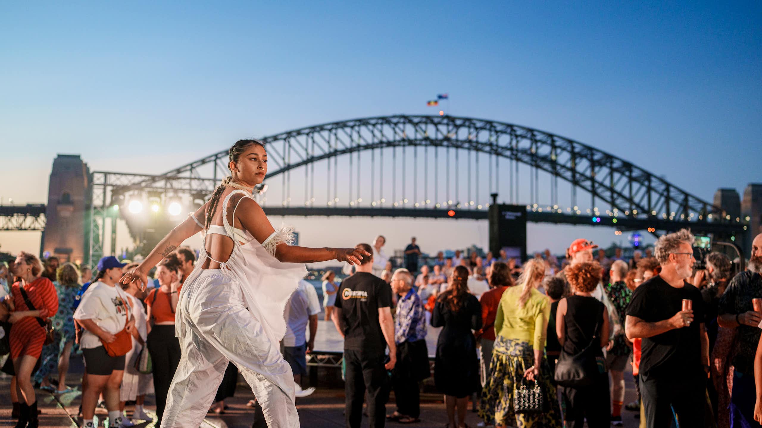 A dancer in front of Sydney Harbour Bridge.