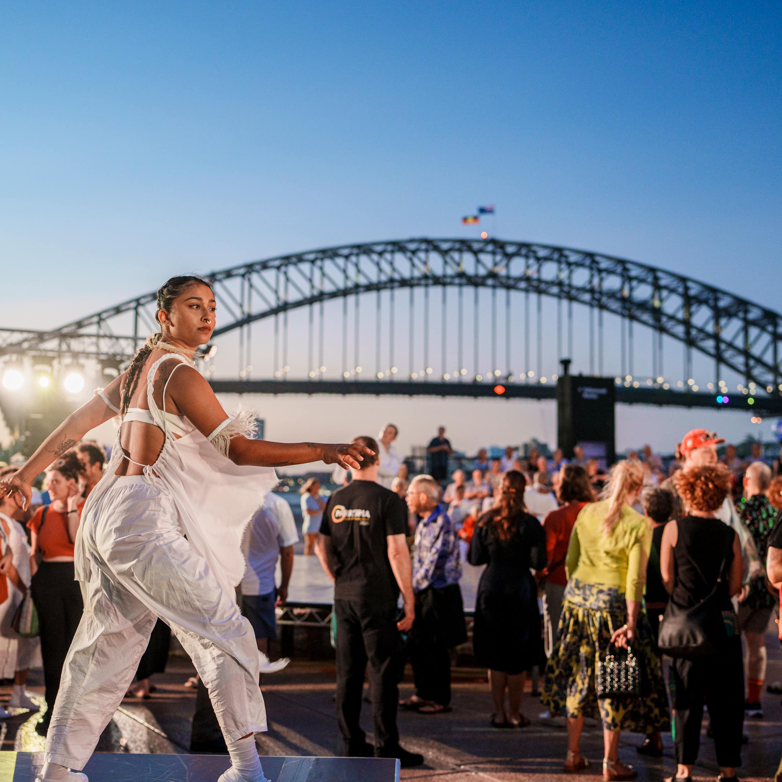 A dancer in front of Sydney Harbour Bridge.