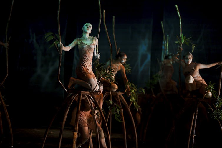 A collection of women on stage.