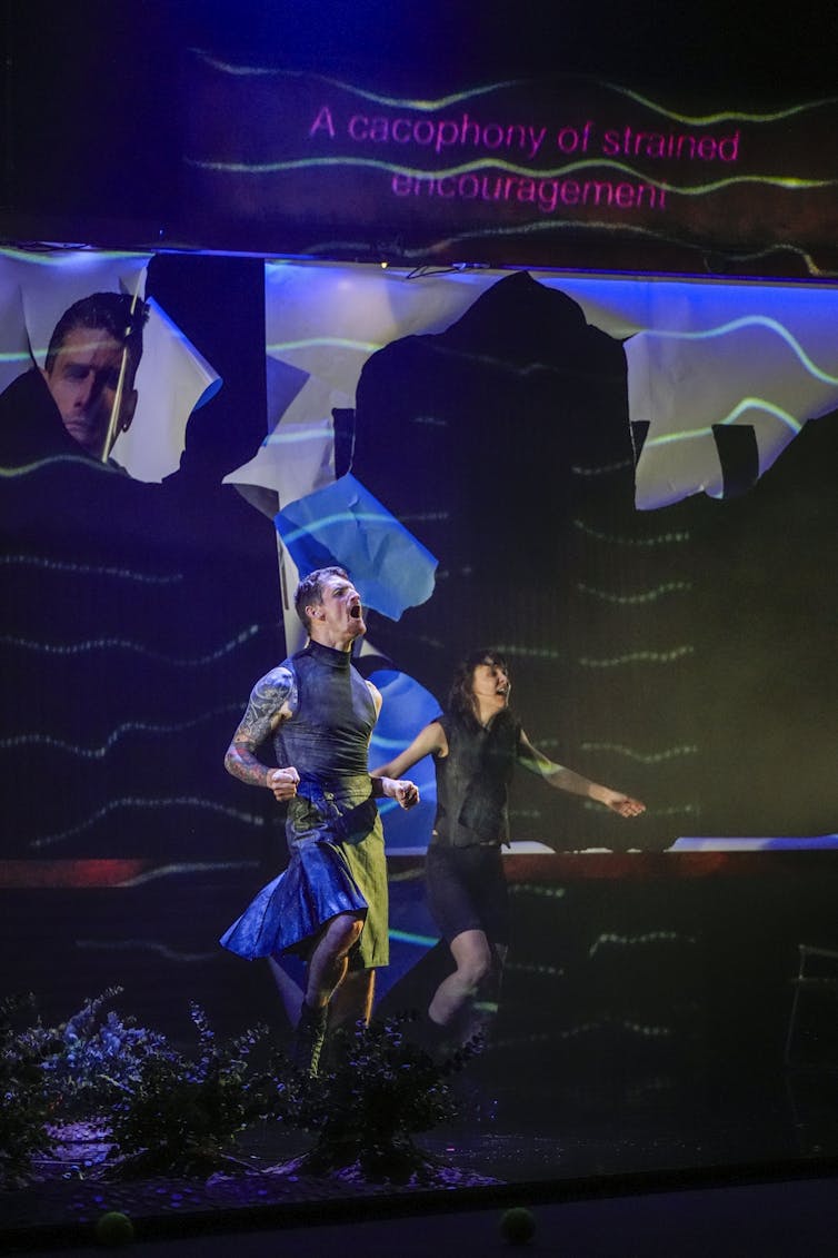 Two people on stage scream.