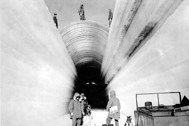 US soldiers digging tunnels in the snow in Greenland in the 1960s.