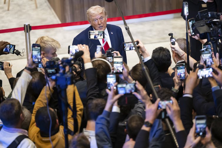 US president Donald Trump speaks with reporters at Davos, January 21 2026.