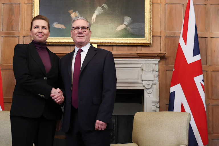 Starmer and Frederiksen shake hands, both facing forward towards the camera, at Chequers