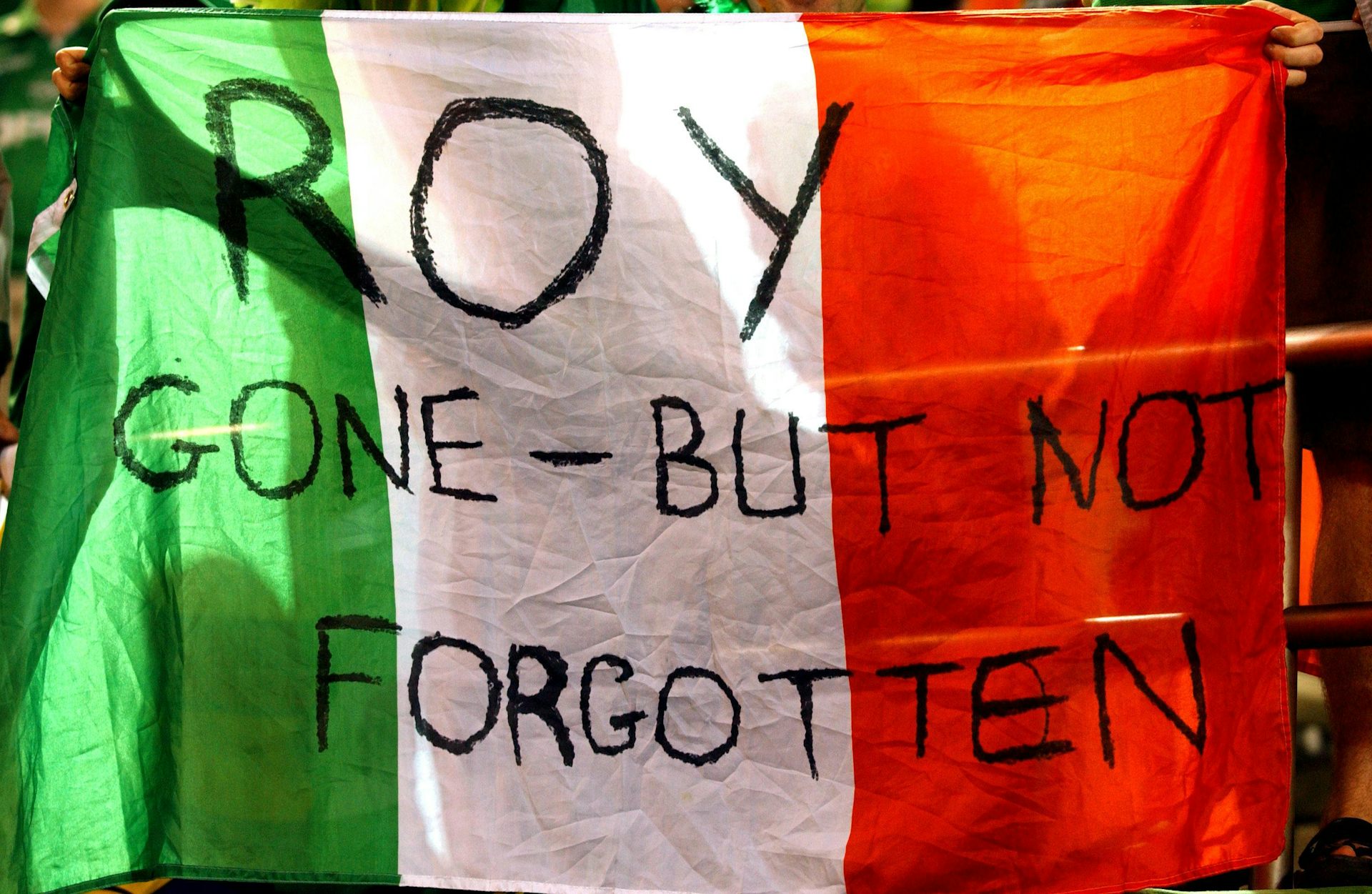 An Irish flag proclaiming: 'Roy - gone but not forgotten'.
