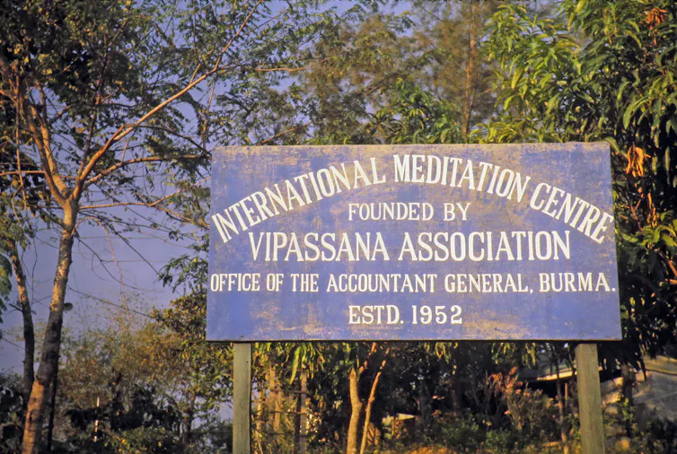 A signboard saying,'International Meditation Center, Founded by Vipassana Association.'