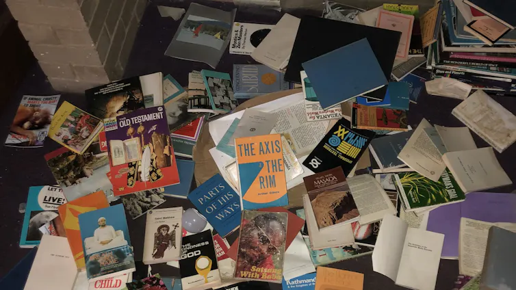 a jumble of books on a carpet
