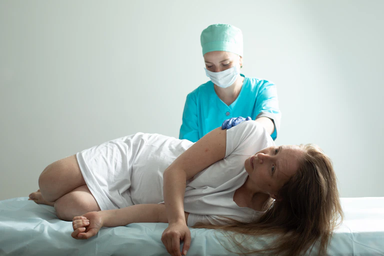 Woman receiving an epidural.