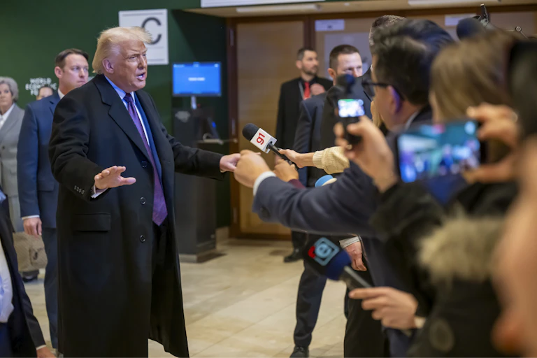 Trump speaks to journalists at the World Economic Forum in Davos.