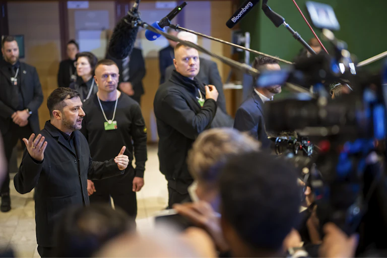 Ukrainian president Volodymyr Zelensky speaks to a crowd of reporters and camera crews in Davos.