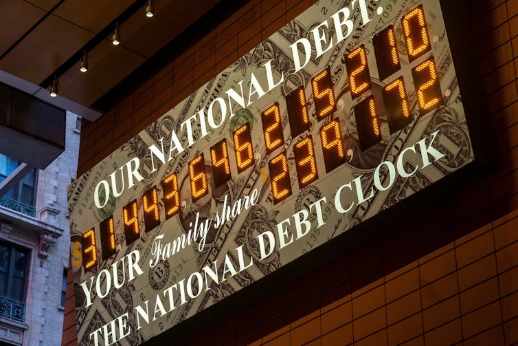 us national debt clock digital display in new york showing a figure of around US$31 trillion as of May 2023.