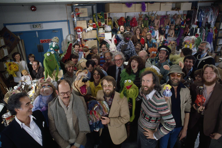 People and Muppets pose for a huge group photo.