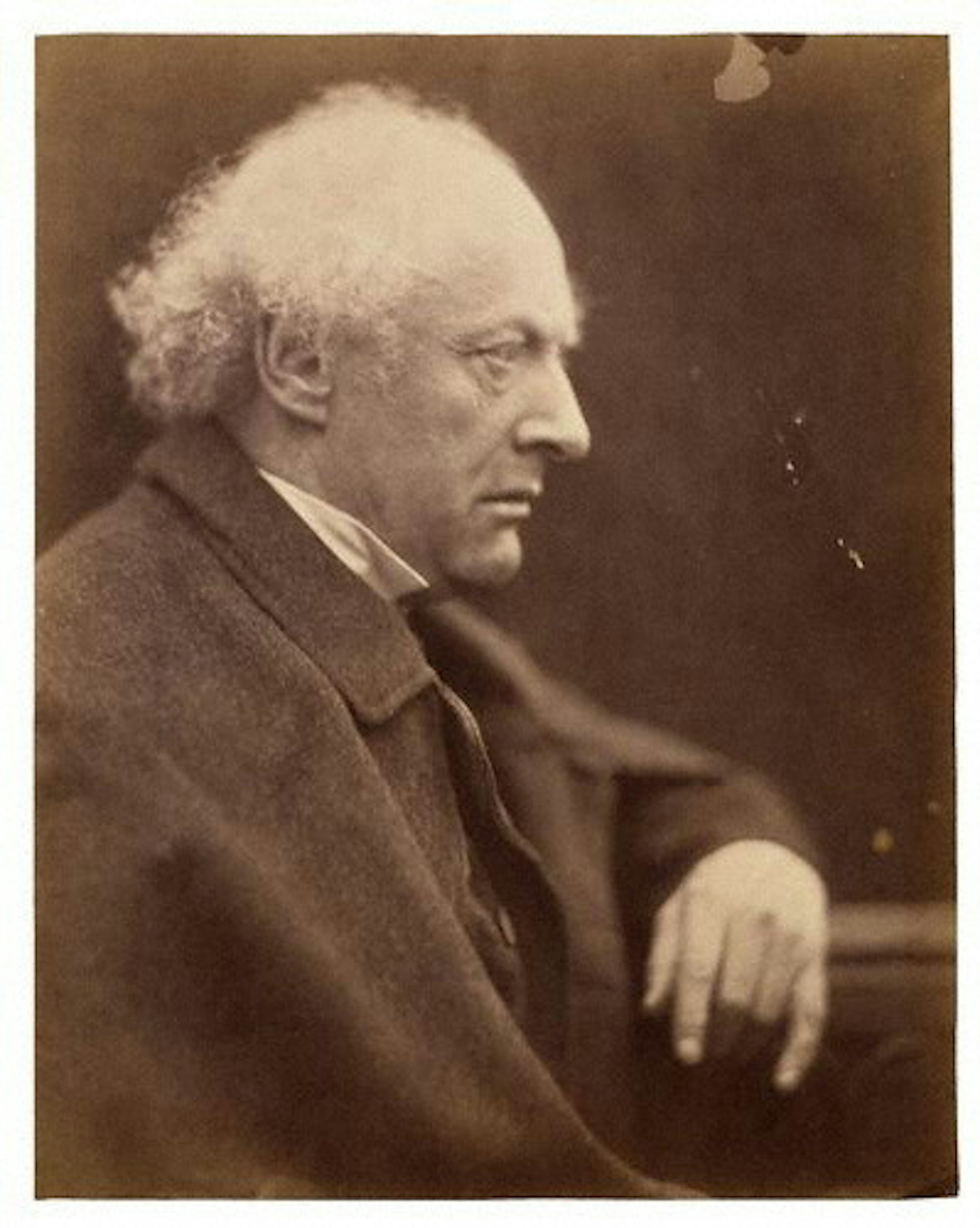 Photo of an elderly man with gray hair.