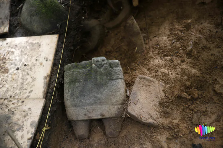 carved stone objects on the dirt