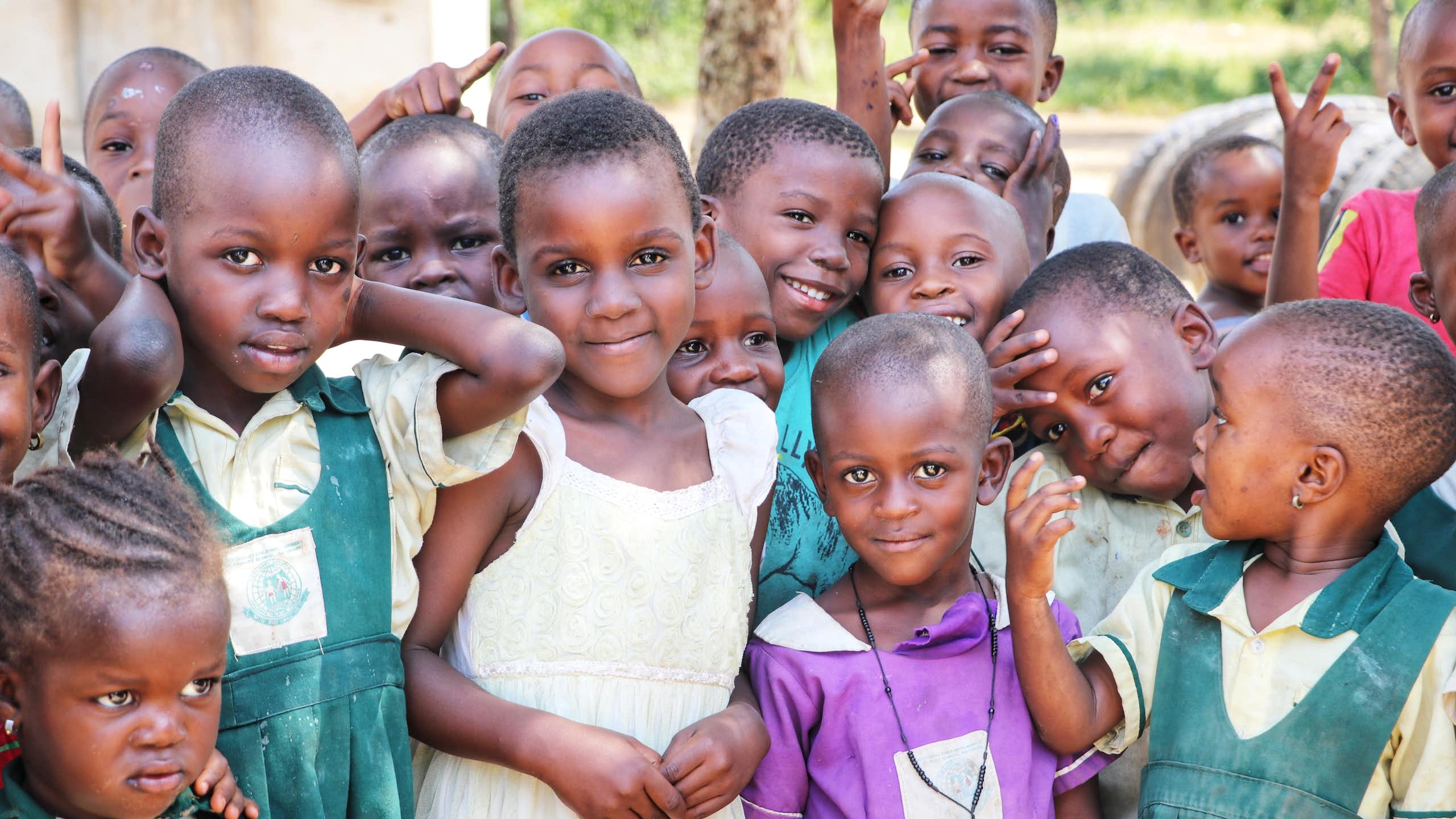 School children gather in a village in Uganda