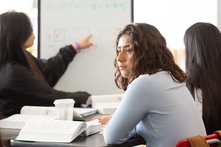 A student with a pensive look on their face.