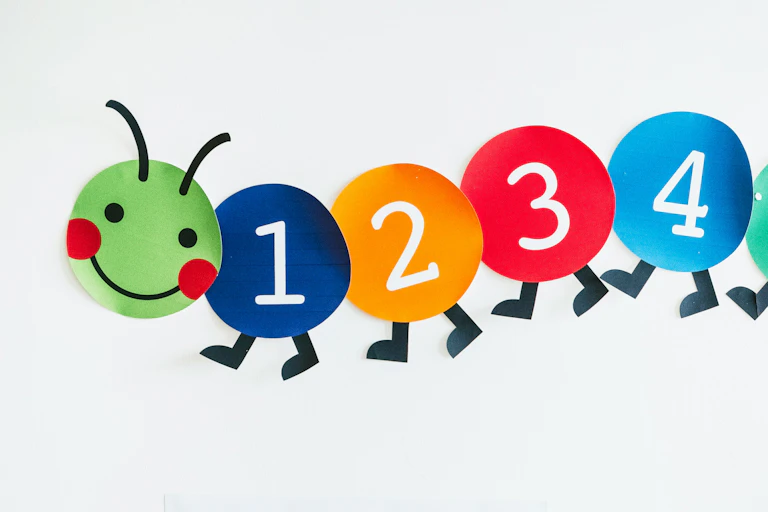 Numbers seen on a wall in the shape of a caterpillar.