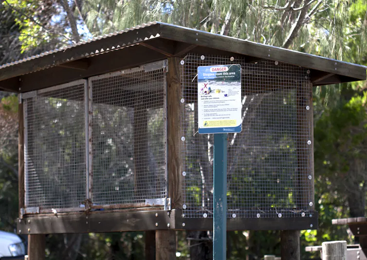 A wood and wire dingo-safe storage cage for visitors to secure food.