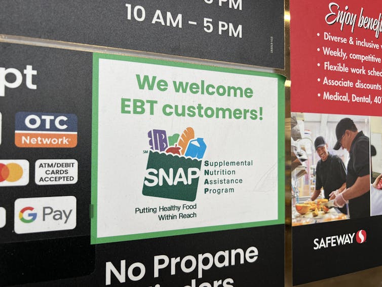 A supermarket sign welcomes SNAP customers.