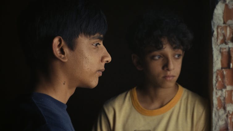 The "Sleepless City" in Canada Actual: Cinema as an Act of Political Justification 1 A photo of the teenager in profile and another from the front.