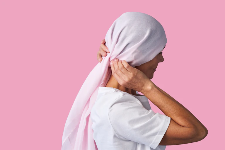 A woman with her head covered.