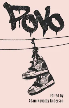 A book cover with graffiti and shoes hanging from a power line