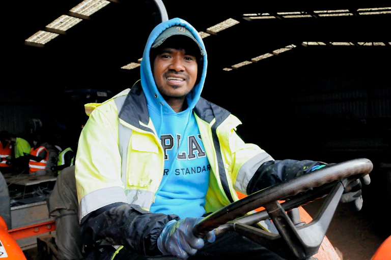 Saturnino Jonnie Soares from Timor Leste, pictured driving a farm vehicle.