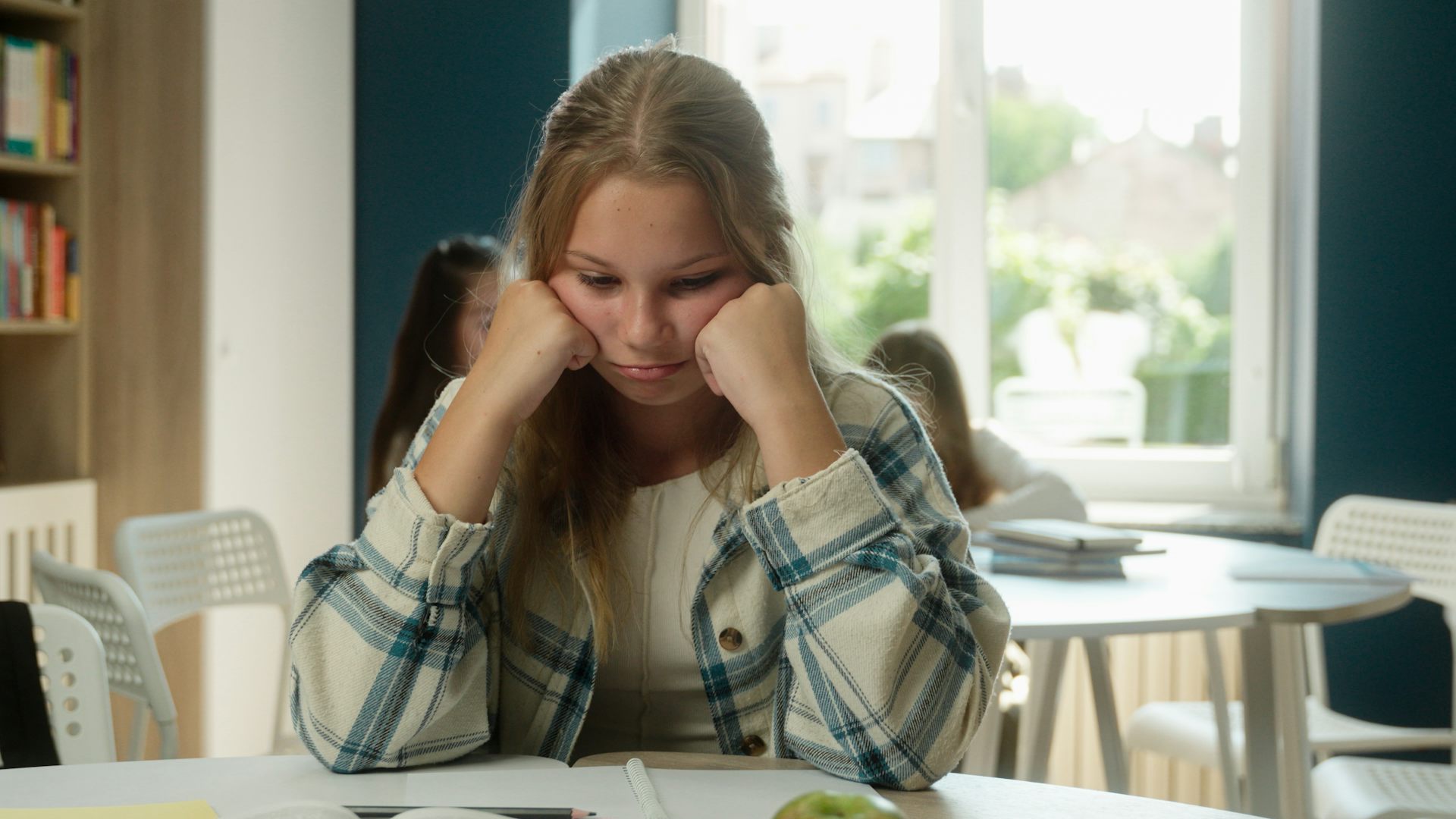Girl looking sad at school