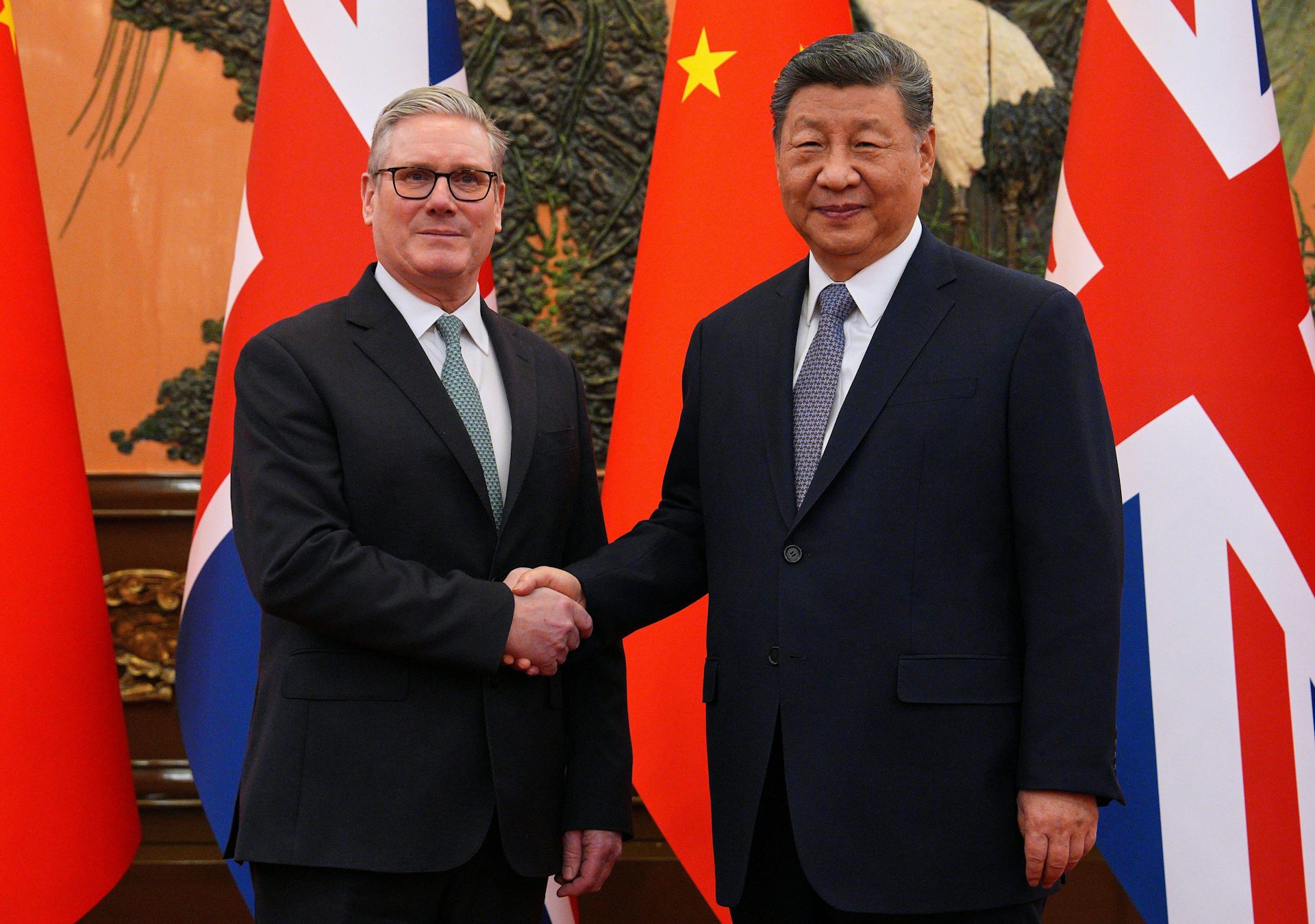 Keir Starmer shaking hands with Chinese President Xi Jinping.