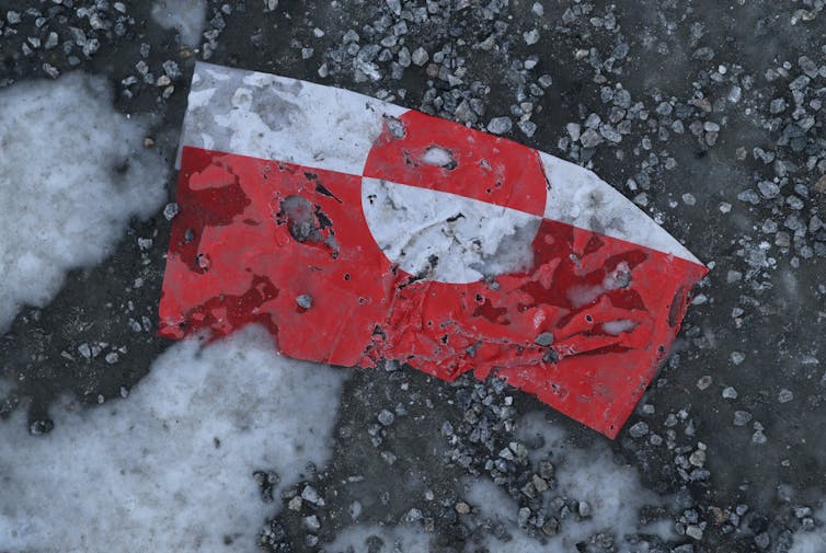 A flag lies on the ground.