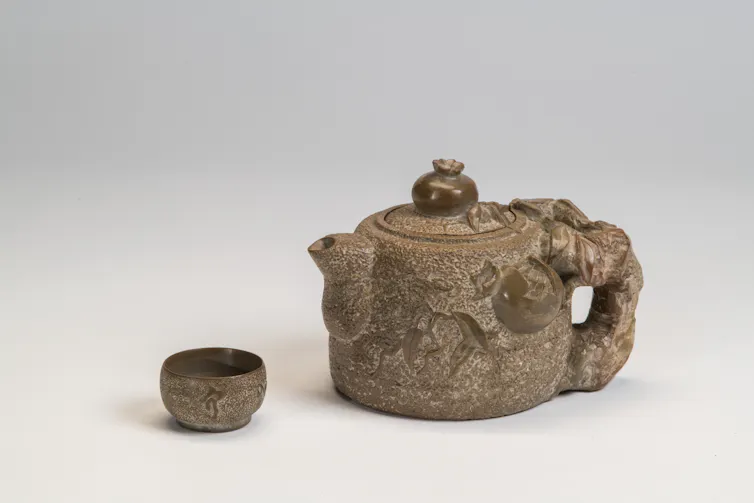 A stone teapot and cup.
