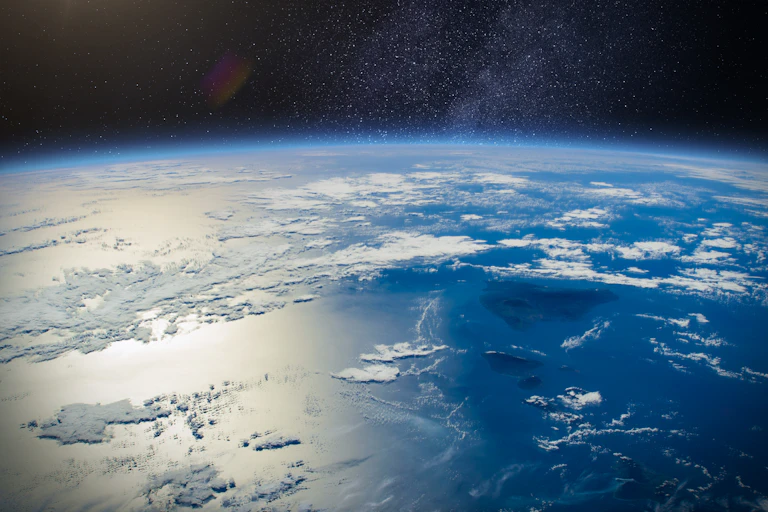 shot from space of Earth and oceans plus dark skies