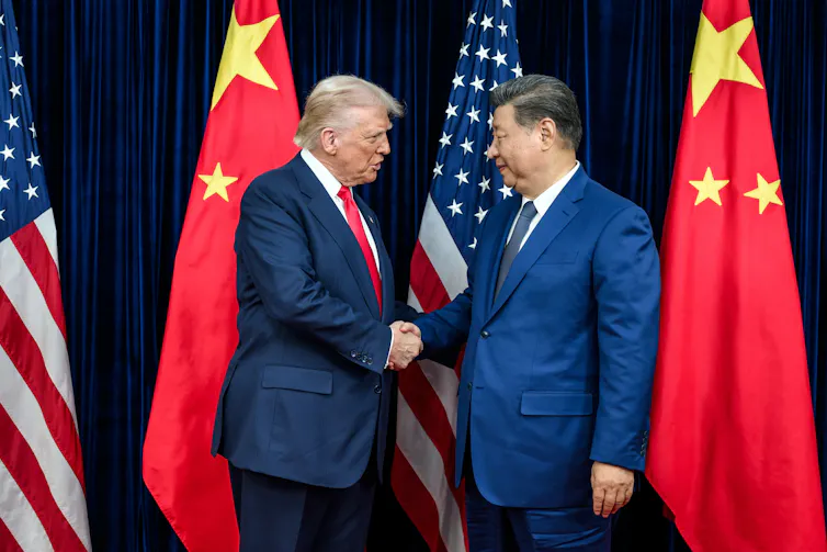 Xi Jinping greets Donald Trump ahead of their meeting in South Korea.