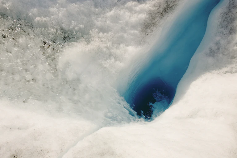 A melted spot amid ice