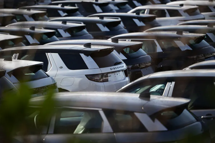 new jaguar cars lined up outside the company's plant in halewood, liverpool.