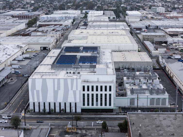 Knowledge facilities advised to pitch in as storms and chilly climate spice up persistent call for 1 A large building amid a group of other large buildings.