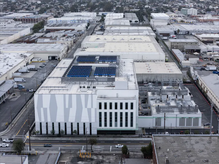 A large building amid a group of other large buildings.