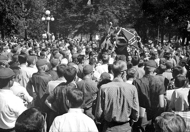 Hundreds of students protest the arrival of a Black student to their school.