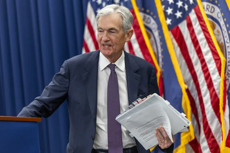 Federal Reserve Board Chairman Jerome Powell departs following a press conference