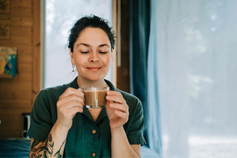 Woman drinks her morning coffee