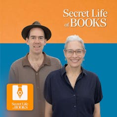 man in a hat and a woman in navy shirt with glasses, both smiling