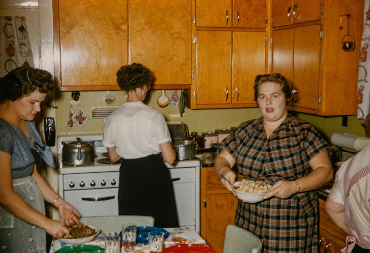 Vintage photo, three women cooking.