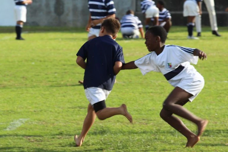 Boys running on a field