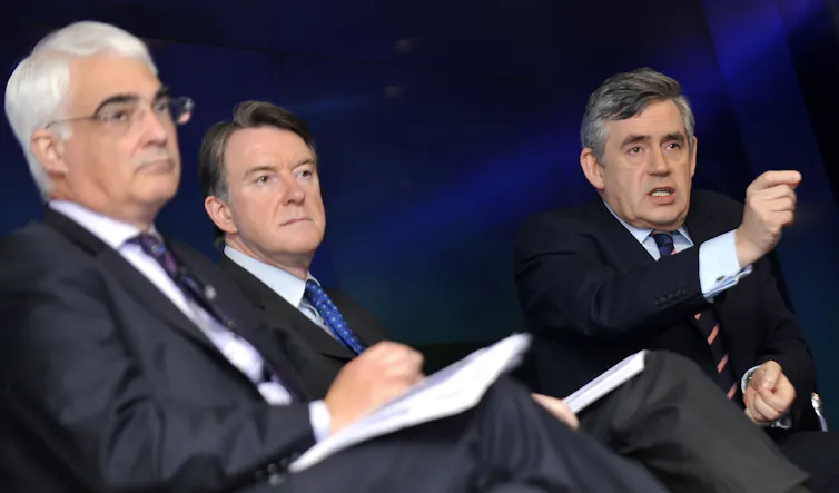 Peter Mandelson sitting between Gordon Brown and Alistair Darling.