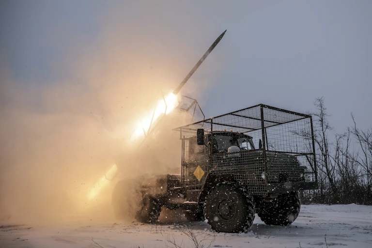 A missile launcher laucnhes a rocket.