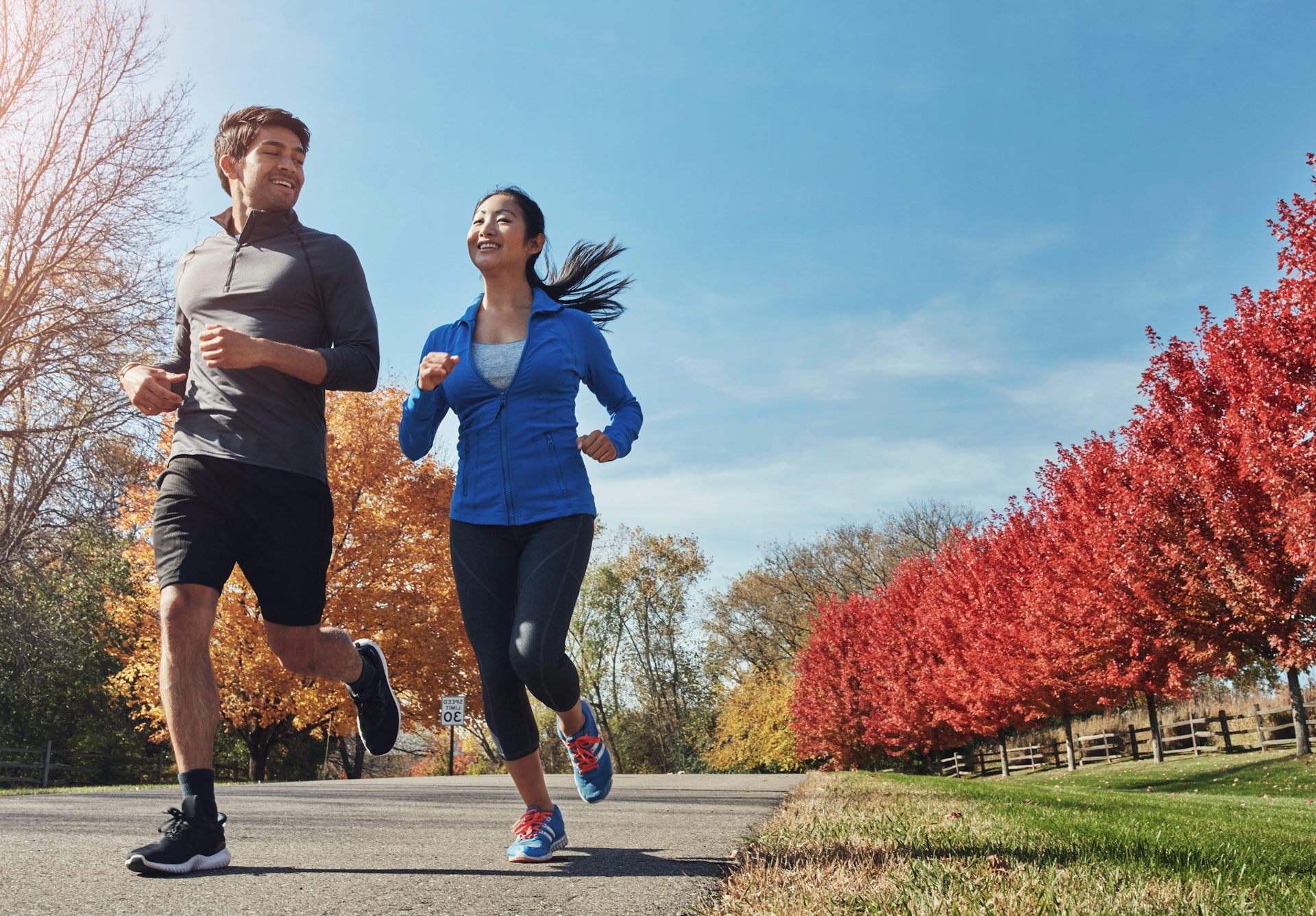 Man and woman jogging together.