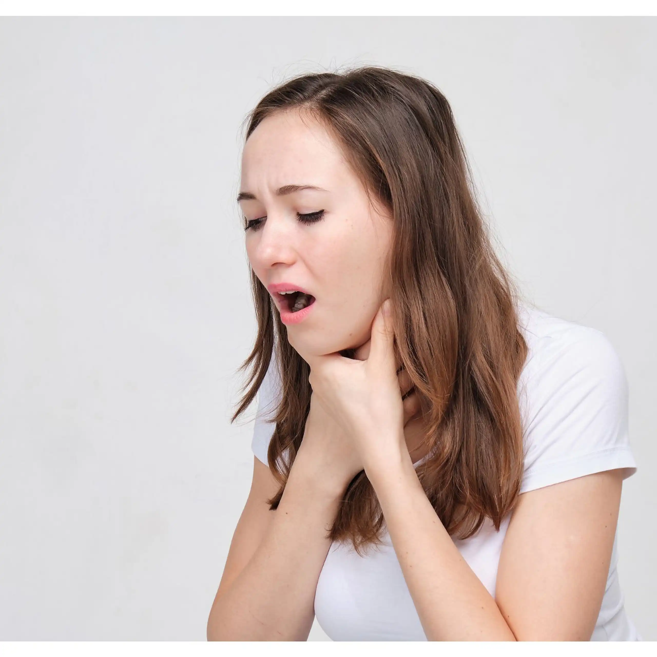 A young woman in a white T-shirt with choking