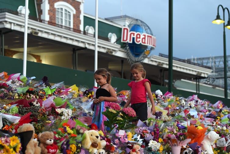 children with flowers outside Dreamworld
