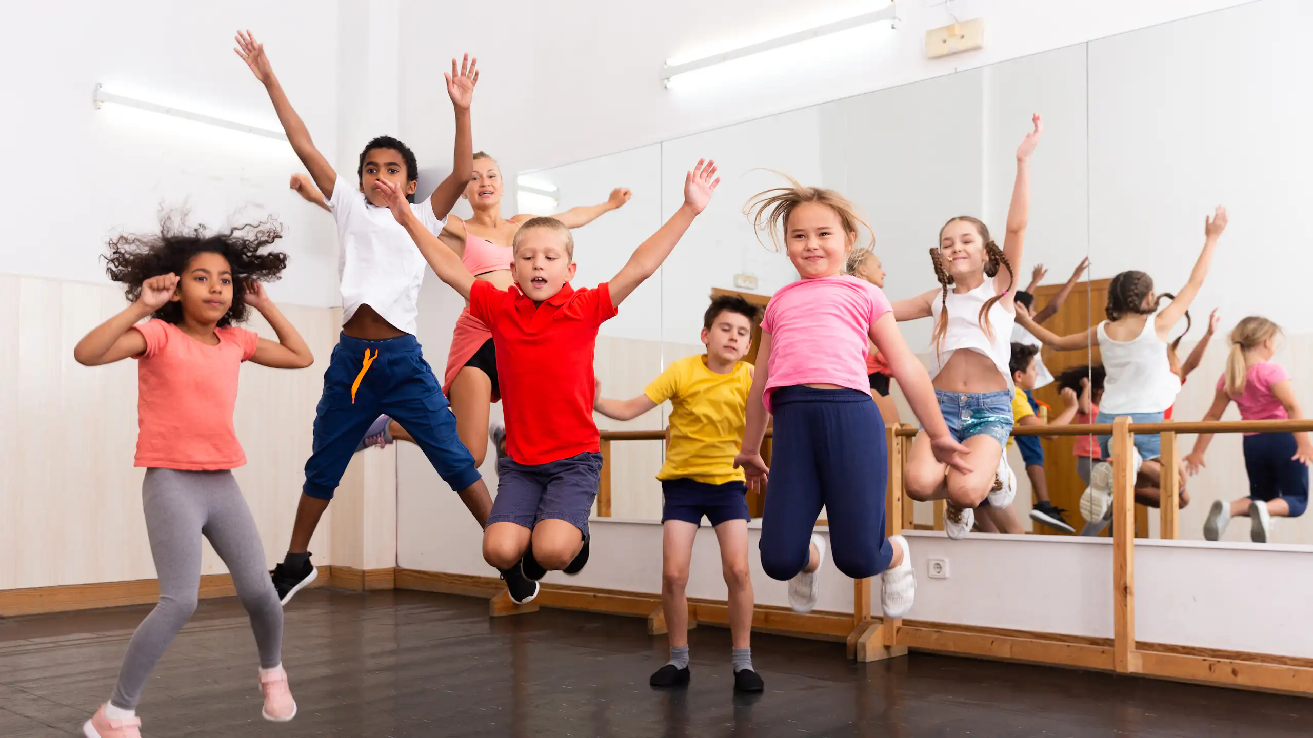 Children jumping in dance studio
