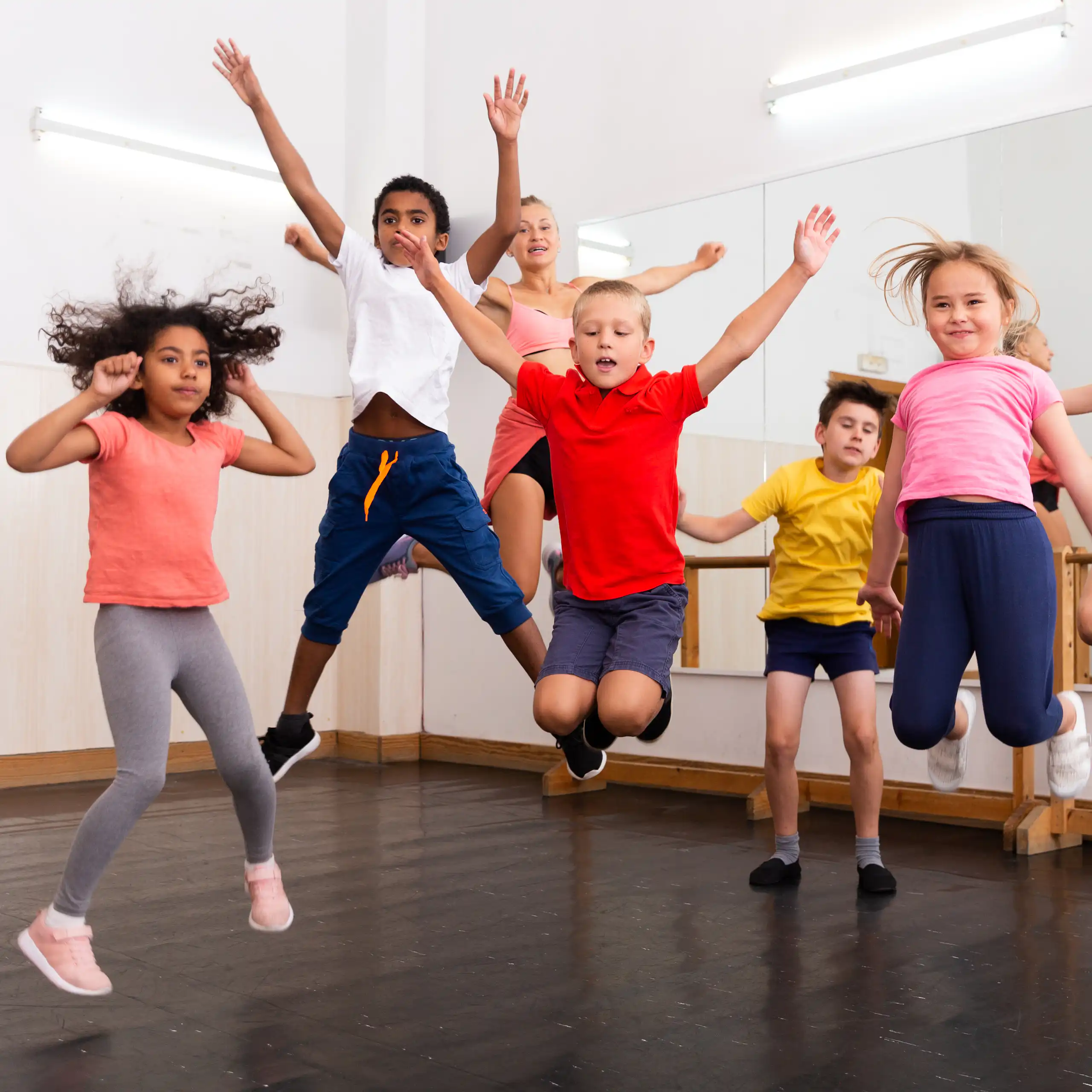 Children jumping in dance studio